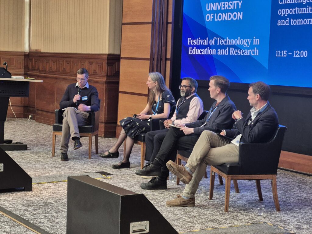 The panel of the session at the front of the Beveridge Hall